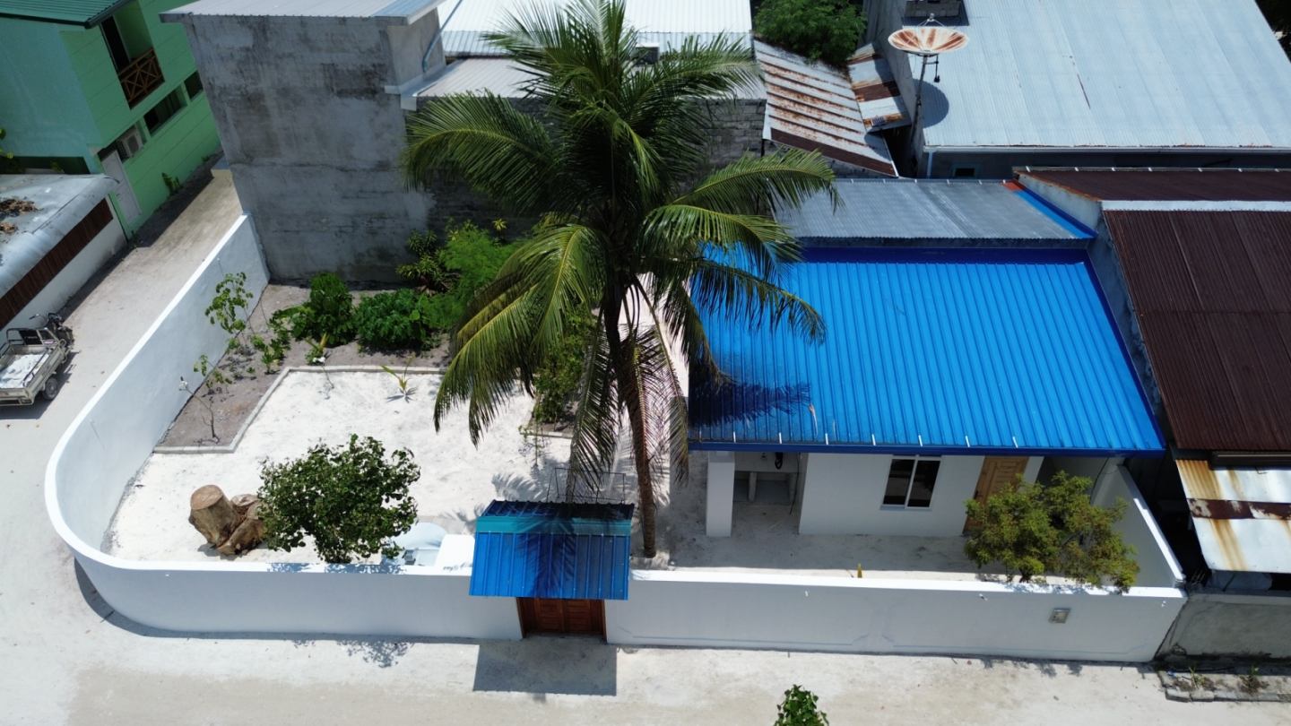 Stunning wide aerial drone panorama layout of Omadhoo atoll canopy